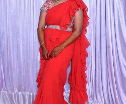 Picture of Red ruffle saree with heavy maggam work