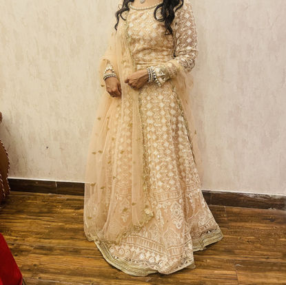 Picture of Peach gown with pearl and thread work