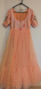 Picture of Peach and pink 2 layered hand work net long Frock