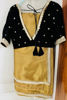 Picture of Golden semi tissue saree with black velvet blouse