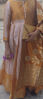 Picture of Gold colour tissue long frock