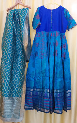 Picture of Peacock blue silk long frock with floral border.