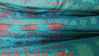 Picture of Peacock blue silk long frock with floral border.
