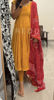 Picture of Mustard yellow anarkali with red modal silk bhandhini duppata.