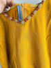 Picture of Mustard yellow anarkali with red modal silk bhandhini duppata.