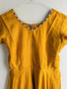 Picture of Mustard yellow anarkali with red modal silk bhandhini duppata.