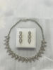 Picture of Silver toned necklace with matching earrings
