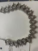 Picture of Silver toned necklace with matching earrings