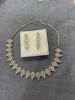 Picture of Silver toned necklace with matching earrings