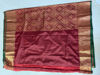 Picture of Maroon pattu saree with all over peacock design (semi soft kanchipattu)