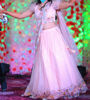 Picture of Beautiful peach based lehenga with a subtle shimmer and multicolour floral embroidery.
