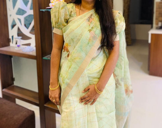 Picture of Pastel green with gold beige & copper zari kota tissue Saree