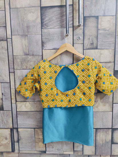 Picture of Peacock blue satin saree with gold blouse