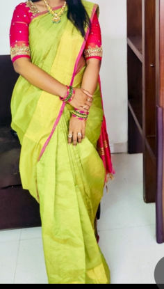 Picture of Parrot green uppada tissue Saree with pink blouse with multicolour embroidery