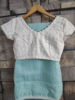 Picture of Never worn ice blue saree with embroidered white blouse