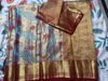 Picture of Never worn Peacock weave pattu  red border saree  with unstitched blouse