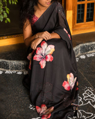 Picture of Black party wear saree with floral unstitched blouse
