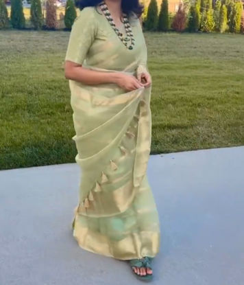 Picture of Organza pista green saree with high neck blouse