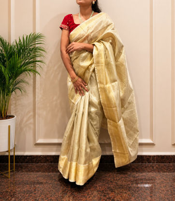 Picture of Golden tissue saree with multi use blouse