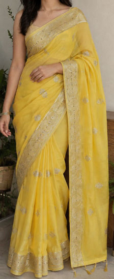 Picture of Bright Yellow saree with nice silver zari and circular lace border