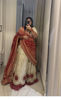 Picture of Ivory lehanga with red bhandej duppata