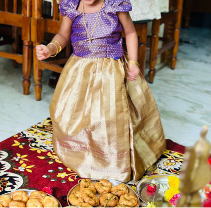 Picture of gold tissue lehanga with purple blouse 1Y