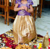 Picture of gold tissue lehanga with purple blouse 1Y