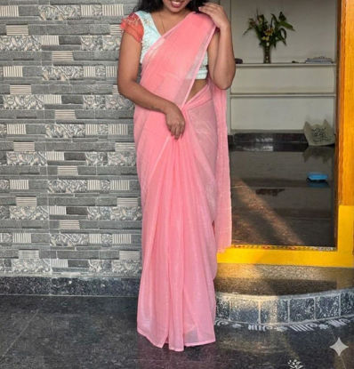 Picture of Jimmy Choo peach saree with designer blouse
