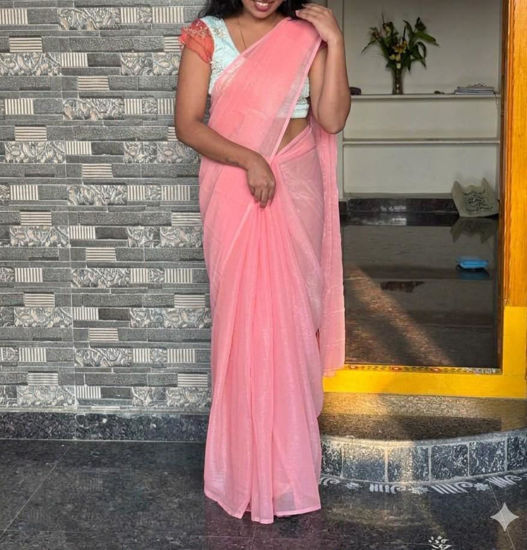 Picture of Jimmy Choo peach saree with designer blouse
